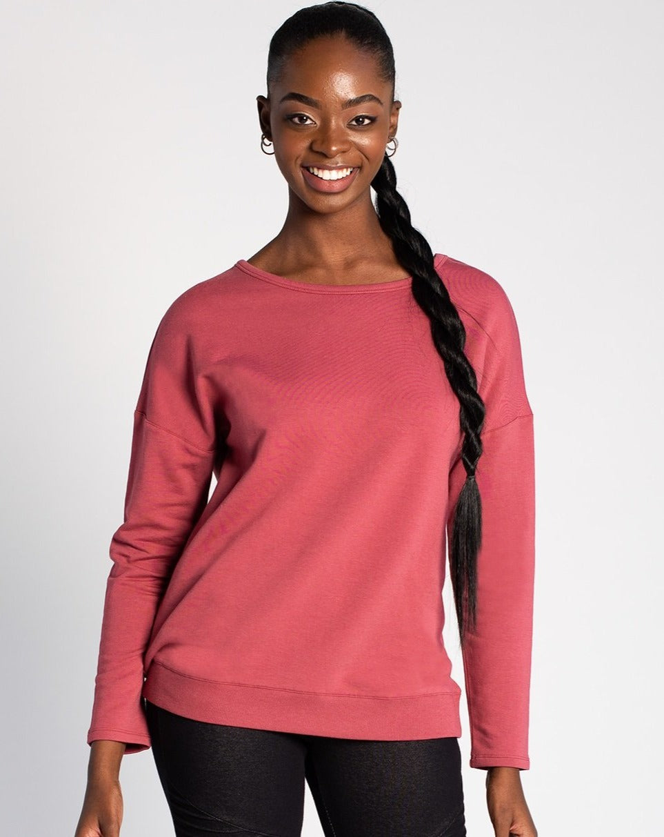 Simple on the front, totally unique on the back! The Riley Crossover Sweater has cross-over panels as well as a keyhole detail on the back. Made this with a cozy bamboo fleece fabric that provides natural insulation to the body.   Fabrication: 66% Viscose from bamboo, 28% Cotton, 6% Spandex TERRERA $95.00 colour Deep Rose Pink