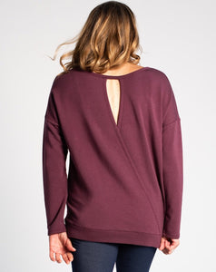 Simple on the front, totally unique on the back! The Riley Crossover Sweater has cross-over panels as well as a keyhole detail on the back. Made this with a cozy bamboo fleece fabric that provides natural insulation to the body.   Fabrication: 66% Viscose from bamboo, 28% Cotton, 6% Spandex TERRERA $95.00 colour Plum Purple