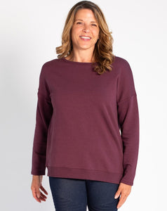 Simple on the front, totally unique on the back! The Riley Crossover Sweater has cross-over panels as well as a keyhole detail on the back. Made this with a cozy bamboo fleece fabric that provides natural insulation to the body.   Fabrication: 66% Viscose from bamboo, 28% Cotton, 6% Spandex TERRERA $95.00 colour Plum Purple