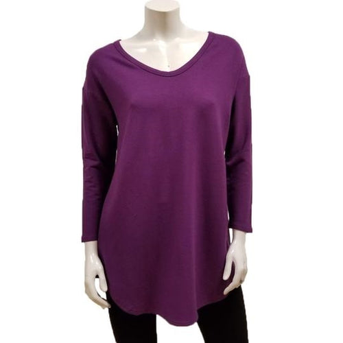 The Tori Tunic has a soft banded V-neckline, 3/4 sleeves, slight A-line shape, and a softly rounded hemline make this the best tunic for your weekends! Or, any day-ends!   Fabrication: 66% Bamboo, 28% Cotton, 6% Spandex  GILMOUR $95.00 colour boysenberry purple