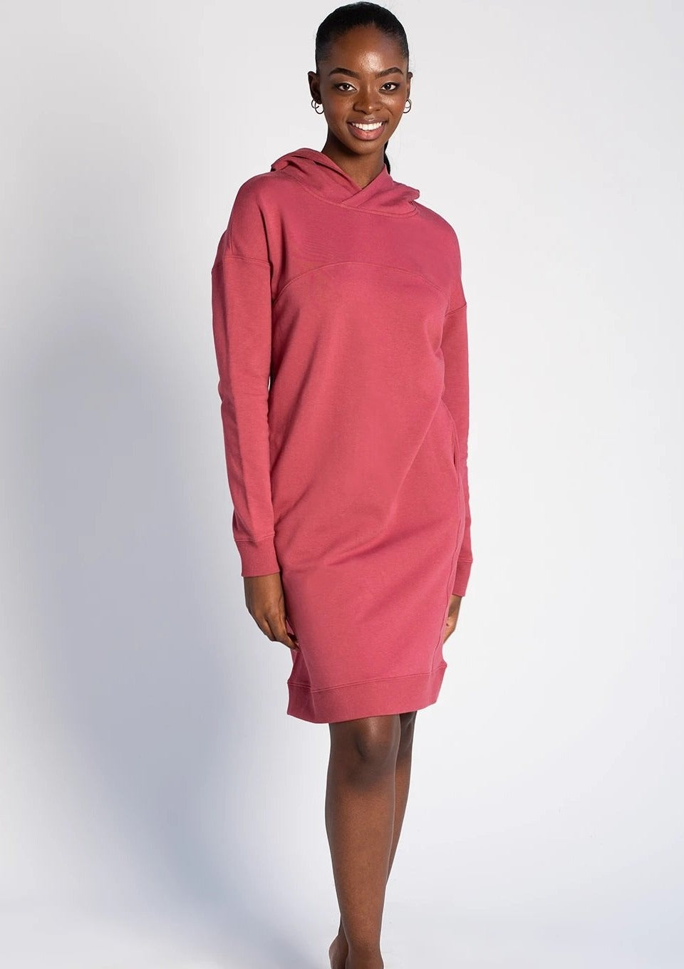 Slip into the Ariel Hoodie Dress with a pair of leggings for an effortless outfit this season. The Ariel Hoodie Dress has been designed with a styling front seam detail, a cozy hood, relaxed drop shoulder, and pockets to provide warmth, style, and practicality. TERRERA colour Deep Rose $115.00