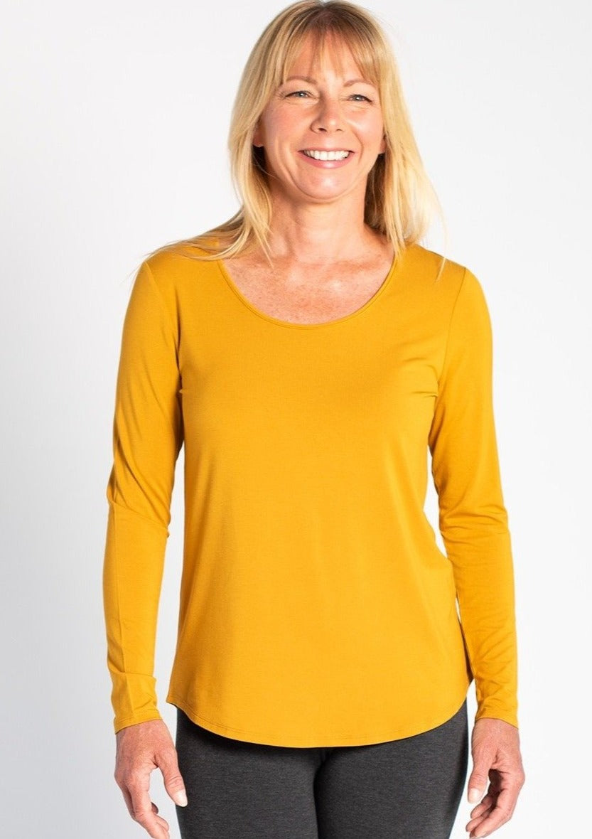 ﻿The beautiful Charis top is classic fit long-sleeve t-shirt featuring a flattering scoop neckline. The curved hemlines on the bottom elongate the body and provide ample coverage. Wear on its own or under a cardigan for added warmth! Fabrication: 95% Viscose from Bamboo 5% Spandex TERRERA Colour harvest gold $60.00