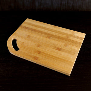 13" x 10" Made with Bamboo, this Cutting Board has a cut-out handle, making it great for adding chopped ingredients to any pot.   VERDICI $18.00