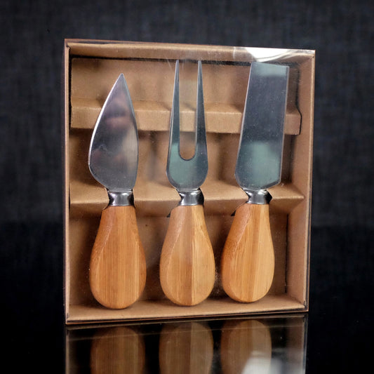 Cheese Cutting Utensils with Bamboo handles. Set includes fork, Sharp edged spreader and sharp edged server. VERDICI $20.00