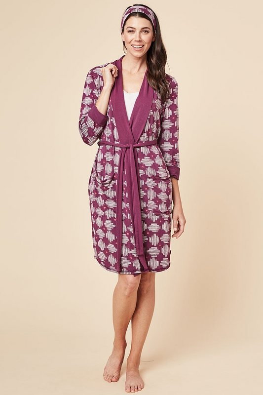 For lounging, getting ready to start your day or even ending it, this soft and breathable Shannon bamboo robe is what you'll always want to be wrapped up in. This robe features deep pockets, a long belt, wide lapel to adjust the way you wrap the robe around your body, and a matching headband. Made from our signature moisture wicking bamboo/spandex fabric. Proudly Made in Canada Fabrication 93% Bamboo Viscose 7% Spandex This Is J Colour Plum Hatch