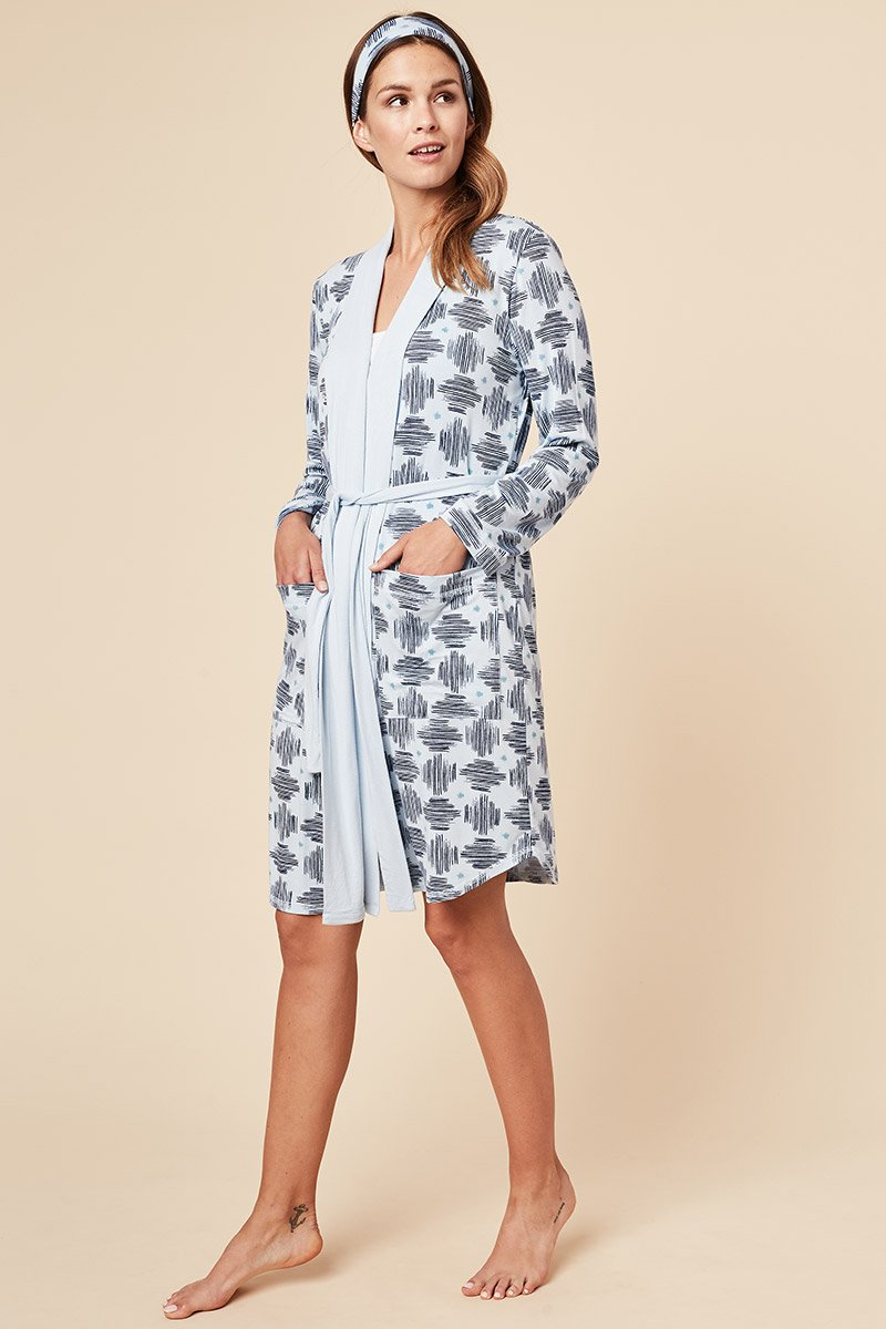 For lounging, getting ready to start your day or even ending it, this soft and breathable Shannon bamboo robe is what you'll always want to be wrapped up in. This robe features deep pockets, a long belt, wide lapel to adjust the way you wrap the robe around your body, and a matching headband. Made from our signature moisture wicking bamboo/spandex fabric. Proudly Made in Canada Fabrication 93% Bamboo Viscose 7% Spandex This Is J Colour Blue Hatch