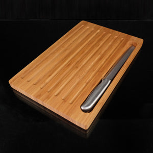 15" X 7" Made with Bamboo the Bread Board with Fitted Knife has lined ridges throughout to help guide the slices when cutting loaves of bread. They also double as great crumb catchers. The serrated knife is sharp and great for slicing bread. VERDICI $40.00