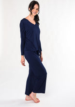 Rest and rejuvenate in the silky-soft lounge set. Made with organic viscose from bamboo, this set features a relaxed fit long-sleeve top and matching pull-on bottoms. $130.00 ink blue