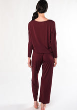 Rest and rejuvenate in the silky-soft lounge set. Made with organic viscose from bamboo, this set features a relaxed fit long-sleeve top and matching pull-on bottoms. $130.00 wine red