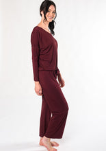 Rest and rejuvenate in the silky-soft lounge set. Made with organic viscose from bamboo, this set features a relaxed fit long-sleeve top and matching pull-on bottoms. V $130.00 wine red
