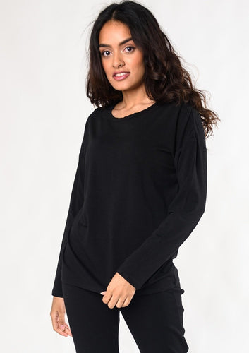 The essential long-sleeve tee. In a beautiful cotton and bamboo blend, this top has a relaxed drop shoulder and a universally flattering crew neck.  Fabrication: 68% Viscose from Bamboo, 28% Cotton, 4% Spandex $65.00 black