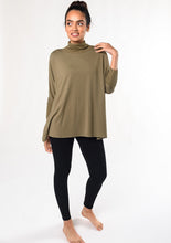 The Colleen top is a fan-favourite mock-neck top updated into a contemporary look. With continuous dolman sleeves and a soft ribbed trim, this french-terry top is an elegant way to stay warm and look Fabulous! Fabrication: 95% Viscose from Bamboo 5% Spandex $95.00 moss green