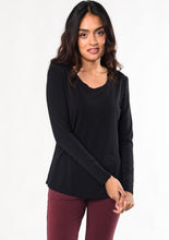 The Melody long sleeve tee has a flattering scoop neck-line and curved high-low hem. This ultra-soft, lightweight basic t-shirt will be a mainstay in your closet for all seasons.  Fabrication: 95% Viscose from Bamboo 5% Spandex $65.00 Black