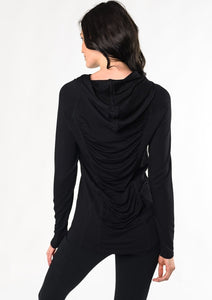 Move freely in this pull-on tunic hoodie. Designed with flattering front-seam details, cascading ruching in the back, and a longer length for hip and bum coverage. Make a match with the Ruched Movement Legging. Fabrication: 95% Viscose from Bamboo 5% Spandex $110.00 black