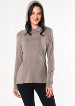 Move freely in this pull-on tunic hoodie. Designed with flattering front-seam details, cascading ruching in the back, and a longer length for hip and bum coverage. Make a match with the Ruched Movement Legging. Fabrication: 95% Viscose from Bamboo 5% Spandex $110.00 taupe brown