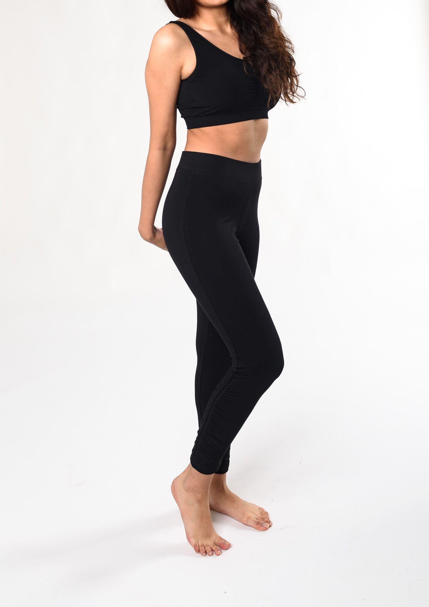 Move freely in this ultra-soft and breathable wide waistband legging. The side ruched detailing is subtle yet special. Make a match with the Ruched Movement Tunic Hoodie. Fabrication: 95% Viscose from Bamboo 5% Spandex $90.00 black