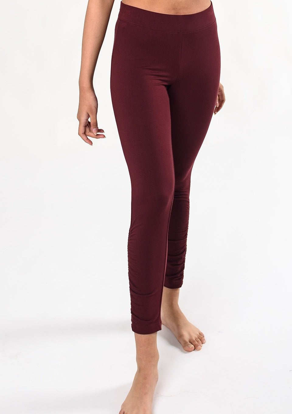 Move freely in this ultra-soft and breathable wide waistband legging. The side ruched detailing is subtle yet special. Make a match with the Ruched Movement Tunic Hoodie. Fabrication: 95% Viscose from Bamboo 5% Spandex $90.00 wine red