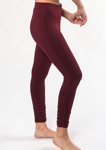 Move freely in this ultra-soft and breathable wide waistband legging. The side ruched detailing is subtle yet special. Make a match with the Ruched Movement Tunic Hoodie. Fabrication: 95% Viscose from Bamboo 5% Spandex $90.00 wine red