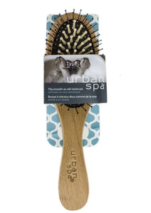 Untangle and massages with the Smooth-as-Silk Hair Brush. Wooden pegs and capped bristles glide through locks, distributing natural hair oils and styling products to those hard-to-reach ends.  High-performance brush. All-natural. Anti-static. Suitable for long, curly, and thick hair. $12.00