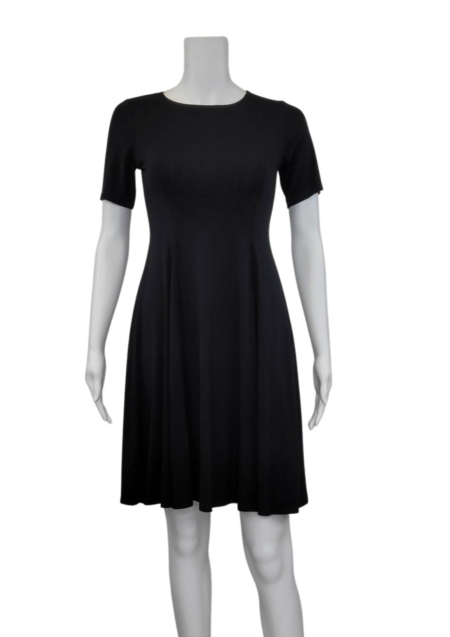 The ﻿Black Bamboo Twirl Dress is a simple and elegant style with a luxurious look and feel. Similar to the Swing Dress, it is a compliment to all body shapes with its princess line fit, round neck, 3/4 sleeve and 3
